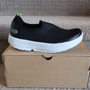 OOFOS Black and White Slip-On Sneakers